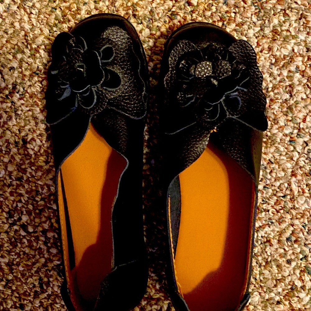 Black leather slip on’s